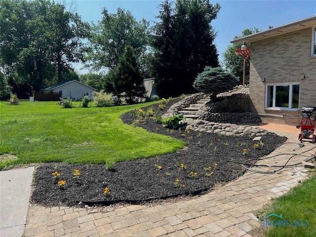 3550 Limerick Rd, Clyde, OH 43410 - view of green lawn featuring a patio