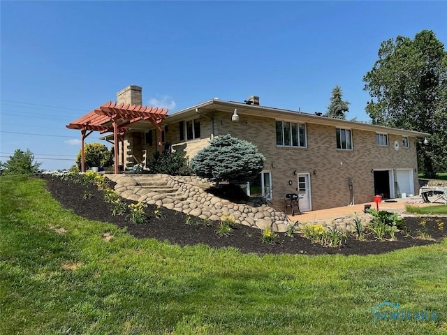 3550 Limerick Rd, Clyde, OH 43410 - rear view of house featuring a chimney, a yard, an attached garage, and brick siding