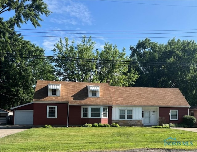 2422 Bodette Ave, Toledo, OH 43613 - new england style home featuring a front lawn and driveway