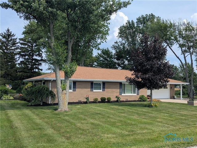 699 N Toussaint S Rd, Oak Harbor, OH 43449 - view of front of house with brick siding, a front lawn, and a garage