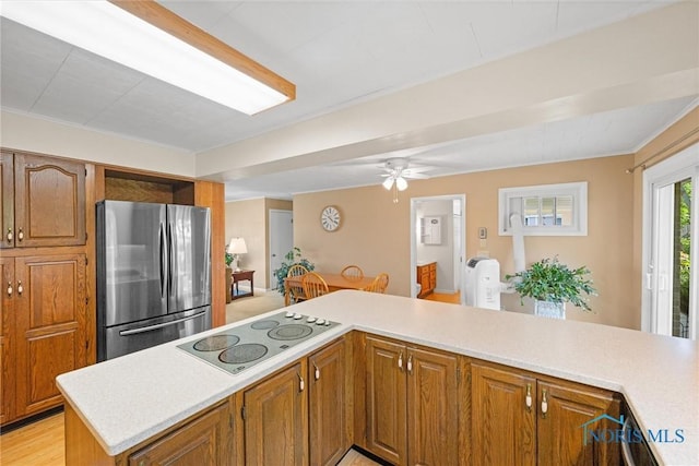 699 N Toussaint S Rd, Oak Harbor, OH 43449 - kitchen with freestanding refrigerator, electric stovetop, and light countertops