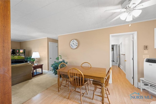 699 N Toussaint S Rd, Oak Harbor, OH 43449 - dining area with wood finished floors, ceiling fan, and crown molding