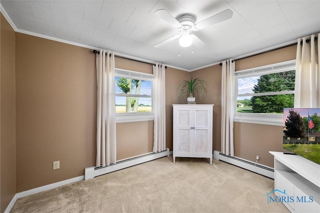 699 N Toussaint S Rd, Oak Harbor, OH 43449 - empty room with baseboard heating, carpet flooring, a ceiling fan, and crown molding