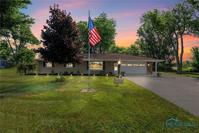 699 N Toussaint S Rd, Oak Harbor, OH 43449 - single story home featuring an attached garage, driveway, and a front lawn