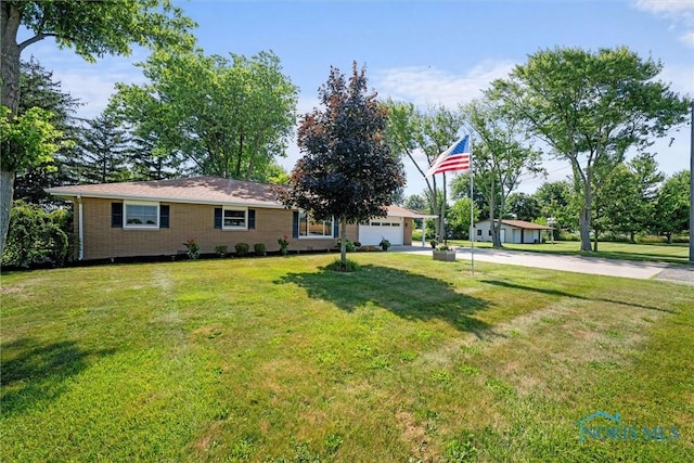 699 N Toussaint S Rd, Oak Harbor, OH 43449 - view of front of house with driveway, a front yard, and a garage