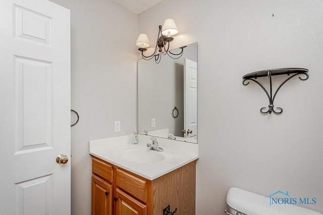820 Weatherstone Rd, Holland, OH 43528 - bathroom featuring vanity and a chandelier