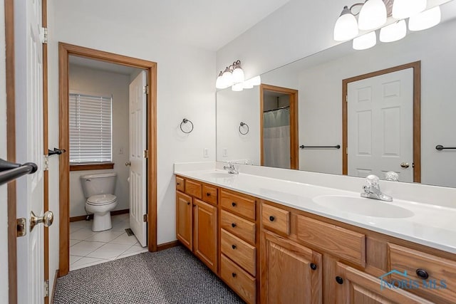 820 Weatherstone Rd, Holland, OH 43528 - full bath featuring double vanity and tile patterned flooring
