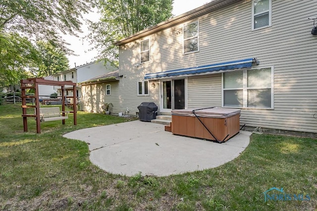 820 Weatherstone Rd, Holland, OH 43528 - rear view of property featuring a hot tub, a patio area, and a yard