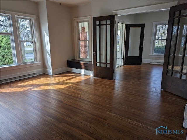 301 E Bigelow St, Upper Sandusky, OH 43351 - entrance foyer featuring dark wood-style flooring and baseboard heating