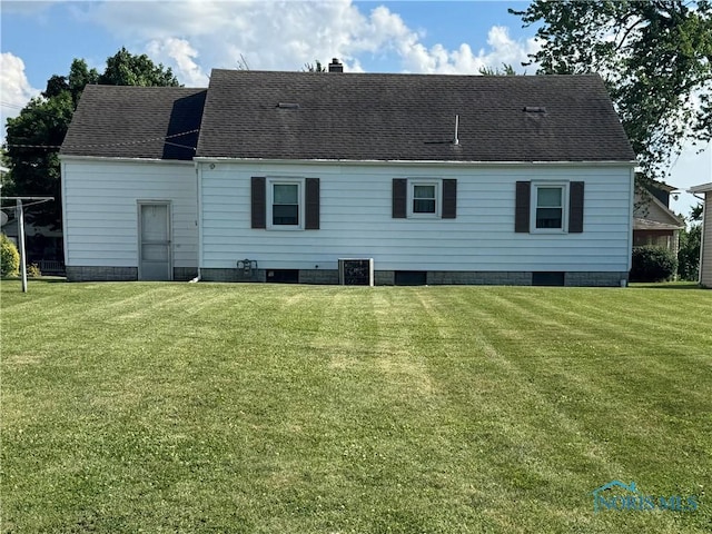 520 W Main St, Leipsic, OH 45856 - rear view of property featuring a yard, a chimney, and roof with shingles