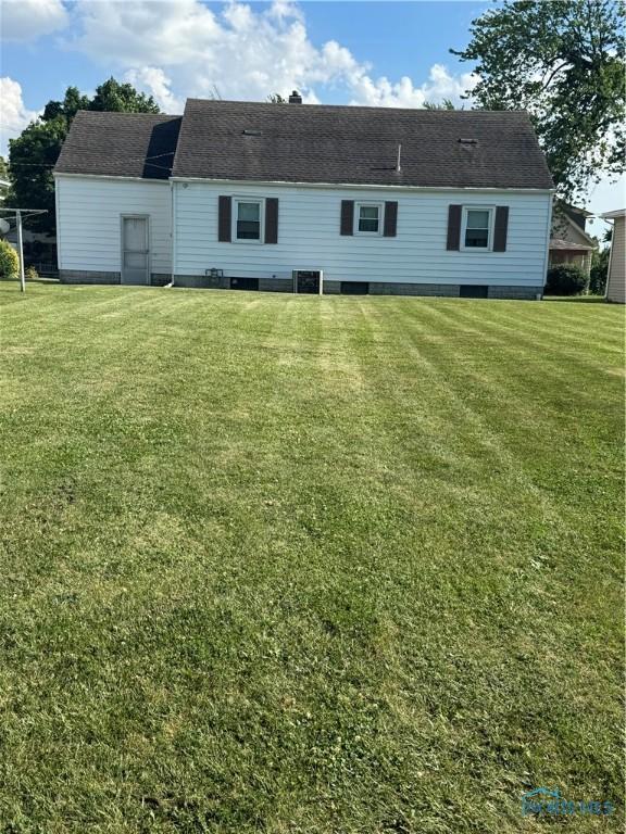 520 W Main St, Leipsic, OH 45856 - rear view of house with a lawn
