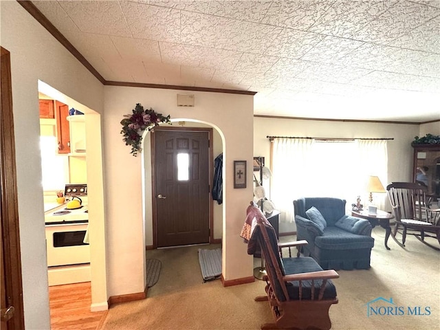 520 W Main St, Leipsic, OH 45856 - carpeted foyer featuring crown molding and arched walkways