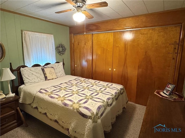 520 W Main St, Leipsic, OH 45856 - carpeted bedroom with a closet, a ceiling fan, and ornamental molding