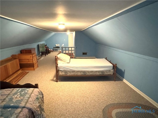 520 W Main St, Leipsic, OH 45856 - carpeted bedroom featuring lofted ceiling and baseboards