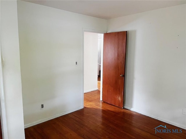 539 W Poinsetta Ave, Toledo, OH 43612 - empty room with wood finished floors and baseboards