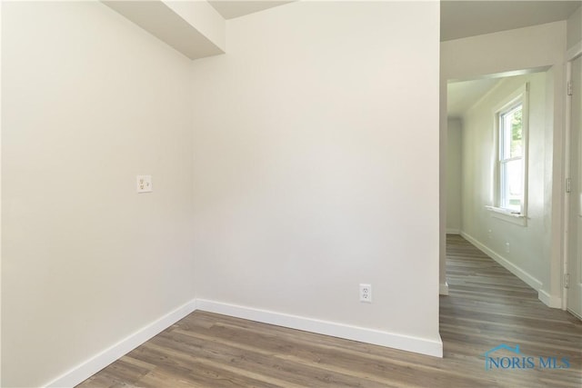 926 Searles Rd, Toledo, OH 43607 - empty room with baseboards and wood finished floors