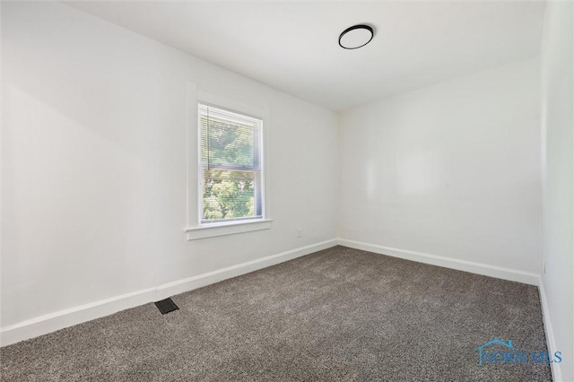 3627 Burton Ave, Toledo, OH 43612 - unfurnished room featuring dark carpet
