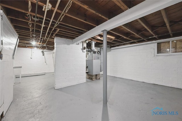 3627 Burton Ave, Toledo, OH 43612 - unfinished basement with heating unit and concrete block wall