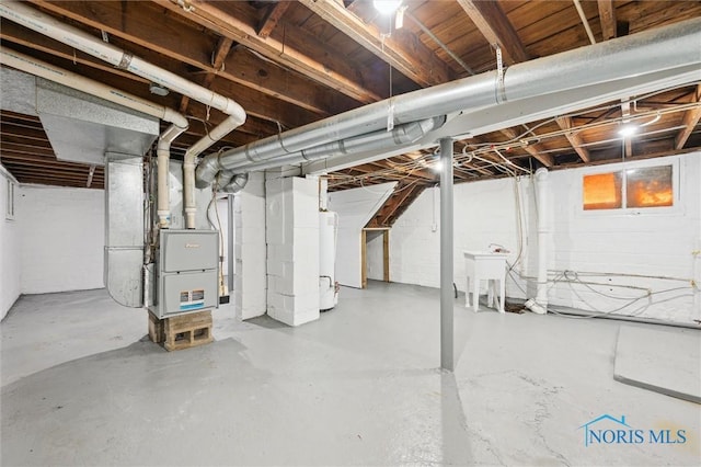 3627 Burton Ave, Toledo, OH 43612 - basement with water heater and heating unit
