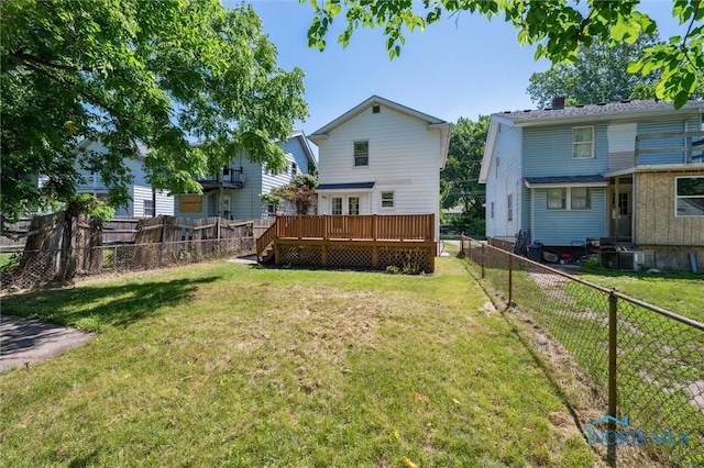 3627 Burton Ave, Toledo, OH 43612 - rear view of property with a wooden deck and a fenced backyard