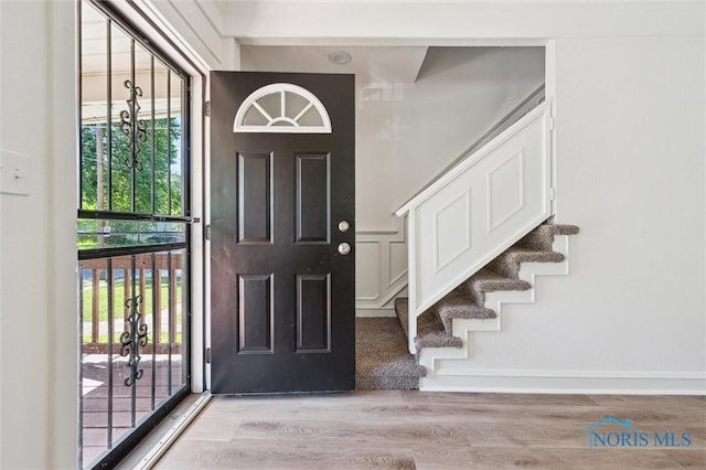 3627 Burton Ave, Toledo, OH 43612 - foyer entrance featuring light wood-type flooring, stairs, and plenty of natural light