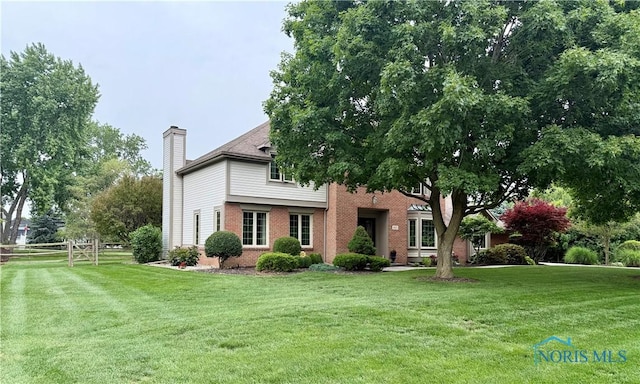 9627 Sheffield Rd, Perrysburg, OH 43551 - view of front of property featuring a chimney and brick siding