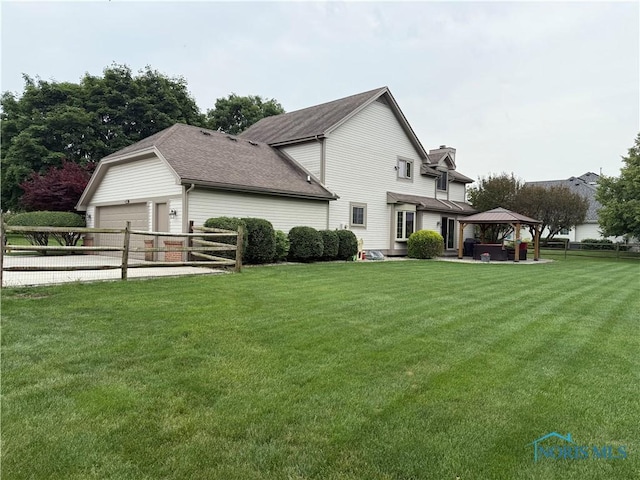 9627 Sheffield Rd, Perrysburg, OH 43551 - rear view of property featuring a gazebo, a garage, a chimney, and a shingled roof