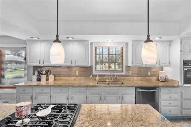 9627 Sheffield Rd, Perrysburg, OH 43551 - kitchen featuring stainless steel appliances, white cabinets, light stone countertops, tasteful backsplash, and pendant lighting