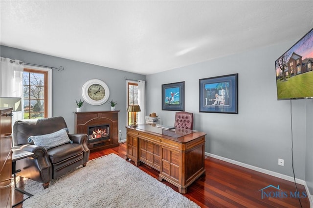 9627 Sheffield Rd, Perrysburg, OH 43551 - office with a warm lit fireplace, wood finished floors, and plenty of natural light