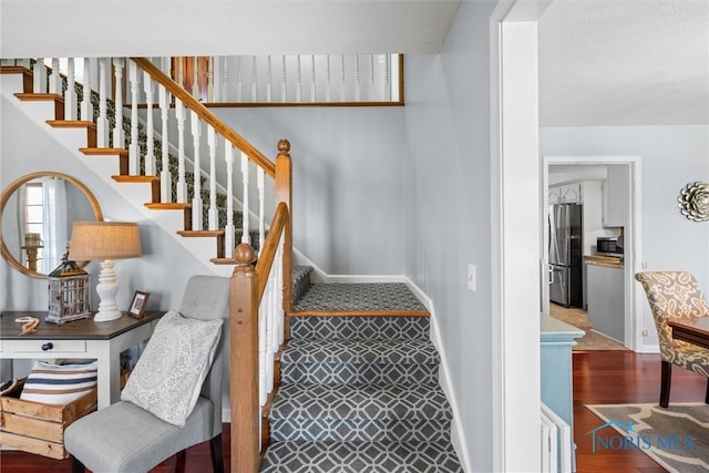 9627 Sheffield Rd, Perrysburg, OH 43551 - staircase with baseboards and wood finished floors