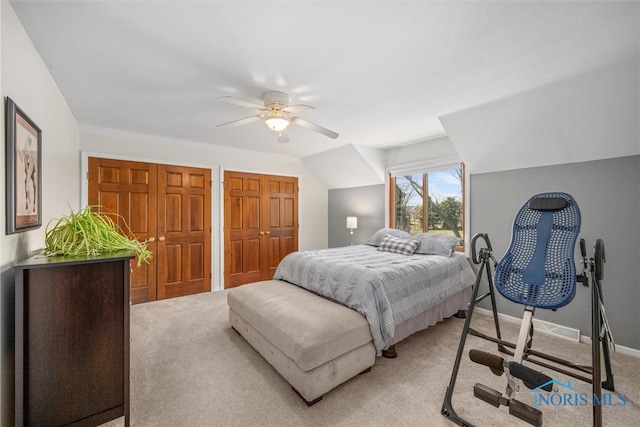 9627 Sheffield Rd, Perrysburg, OH 43551 - bedroom with light colored carpet, ceiling fan, and two closets