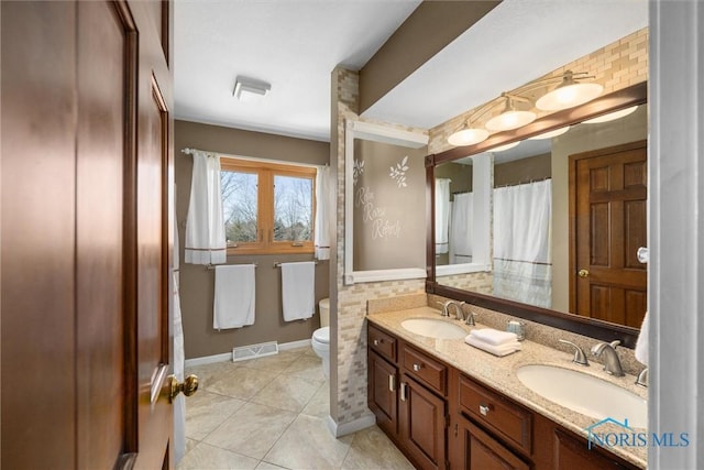 9627 Sheffield Rd, Perrysburg, OH 43551 - bathroom featuring double vanity and tile patterned flooring