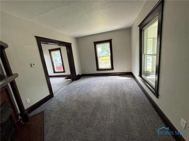 331 Buckeye St, Toledo, OH 43611 - carpeted empty room with plenty of natural light and a textured ceiling
