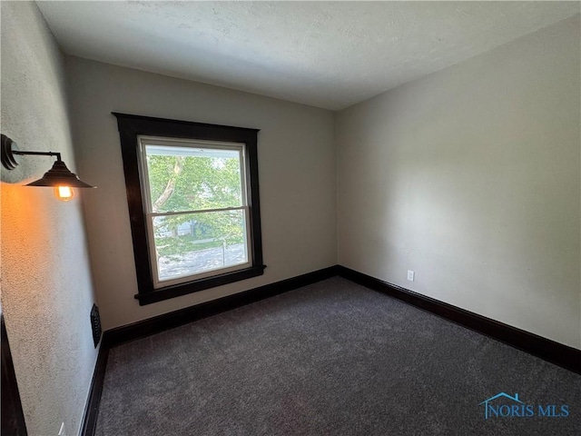 331 Buckeye St, Toledo, OH 43611 - unfurnished room featuring dark carpet