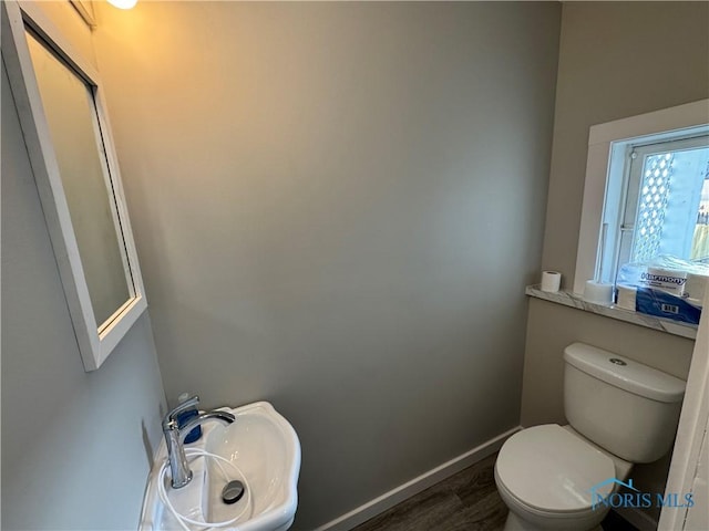 331 Buckeye St, Toledo, OH 43611 - bathroom featuring a sink and wood finished floors