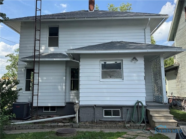 331 Buckeye St, Toledo, OH 43611 - rear view of house with a chimney and a shingled roof