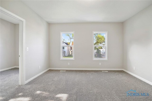 145 E Crocker St, Fostoria, OH 44830 - unfurnished room featuring carpet floors and baseboards
