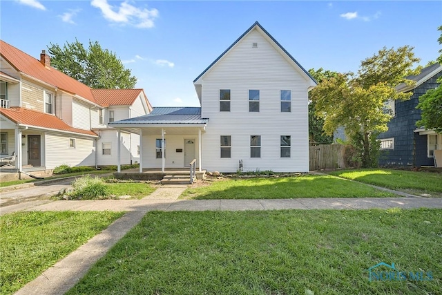 145 E Crocker St, Fostoria, OH 44830 - view of front facade with a porch and a metal roof