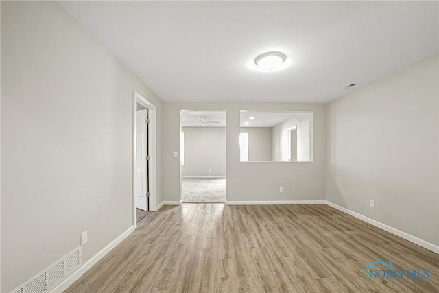 145 E Crocker St, Fostoria, OH 44830 - unfurnished room with wood finished floors and baseboards