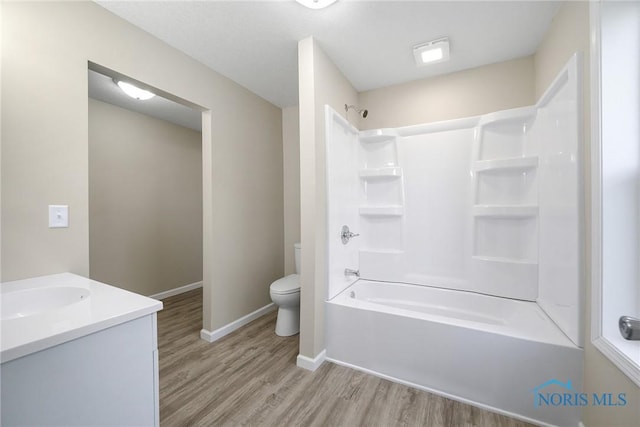 145 E Crocker St, Fostoria, OH 44830 - bathroom with wood finished floors, vanity, and shower / tub combination