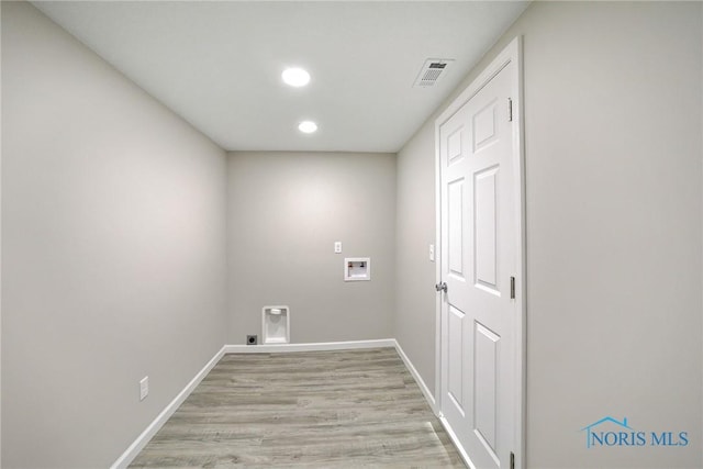 145 E Crocker St, Fostoria, OH 44830 - washroom featuring hookup for a washing machine, light wood-style floors, recessed lighting, and electric dryer hookup