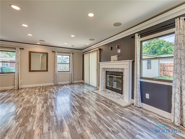 1323 Richland St, Maumee, OH 43537 - unfurnished living room with ornamental molding, a premium fireplace, wood finished floors, and recessed lighting