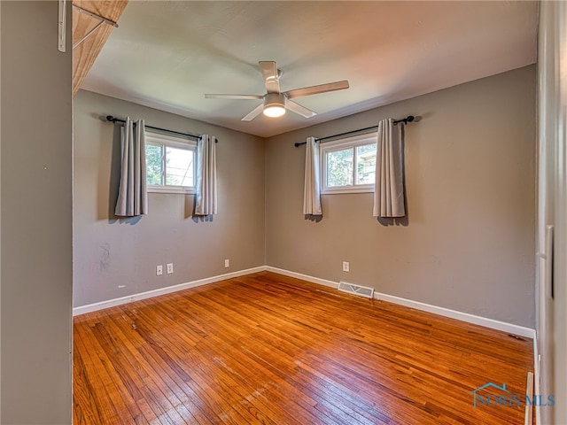 1323 Richland St, Maumee, OH 43537 - unfurnished room with healthy amount of natural light, a ceiling fan, and hardwood / wood-style flooring