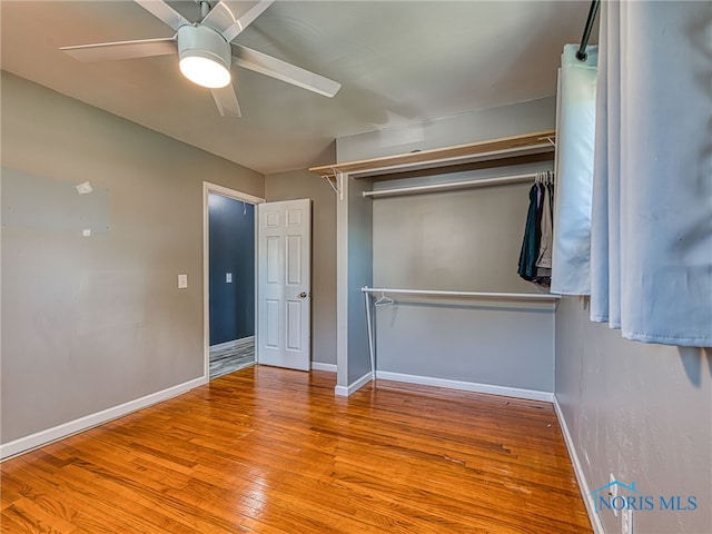 1323 Richland St, Maumee, OH 43537 - unfurnished bedroom featuring hardwood / wood-style flooring, ceiling fan, and a closet