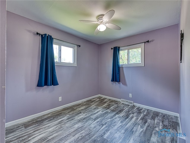 1323 Richland St, Maumee, OH 43537 - unfurnished room featuring plenty of natural light, wood finished floors, and ceiling fan