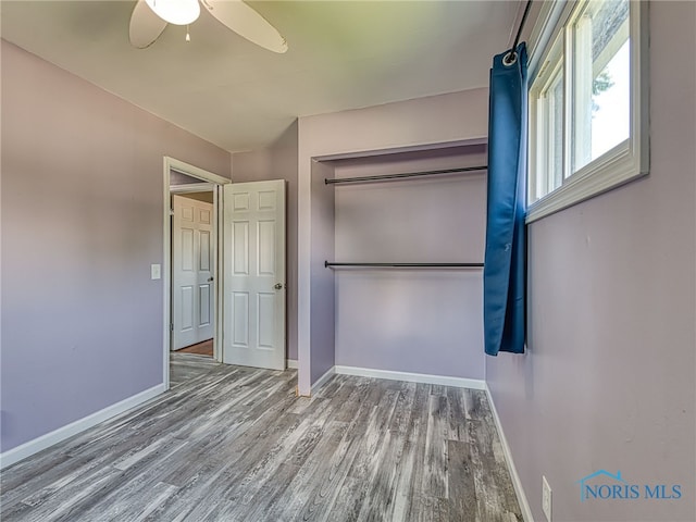 1323 Richland St, Maumee, OH 43537 - unfurnished bedroom featuring wood finished floors, a closet, and ceiling fan