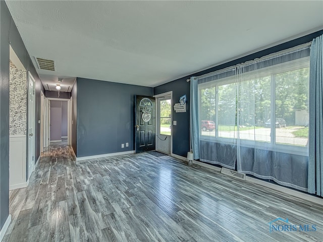 1323 Richland St, Maumee, OH 43537 - unfurnished living room featuring attic access and wood finished floors