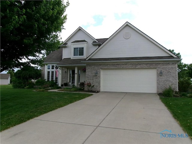 26608 Amberwood Dr, Perrysburg, OH 43551 - traditional home featuring brick siding, a front lawn, a garage, and driveway