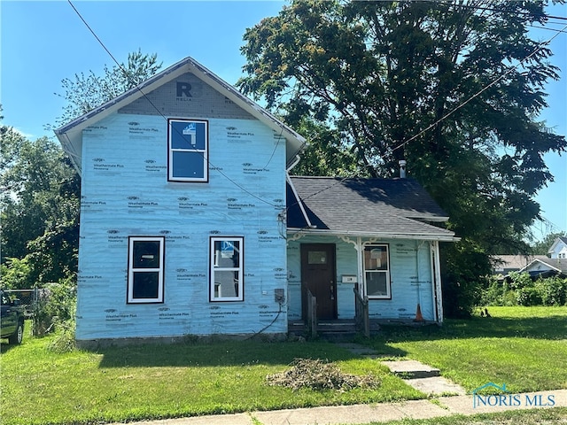 119 Spring Ave, Clyde, OH 43410 - property under construction featuring a front yard and covered porch