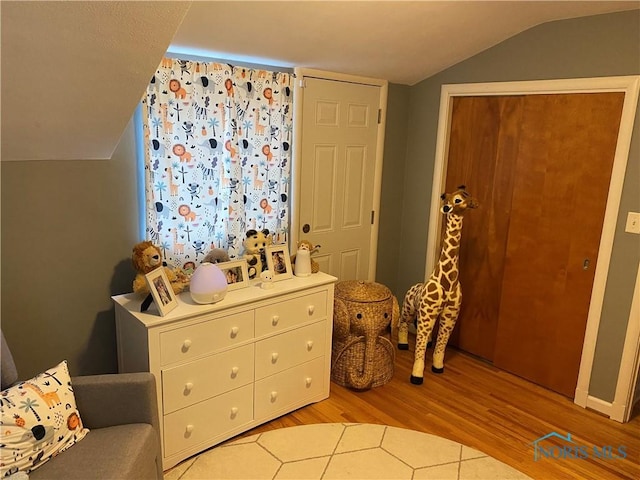 2950 Darlington Rd, Toledo, OH 43606 - bedroom featuring wood finished floors and vaulted ceiling